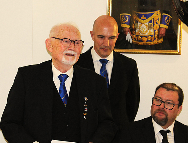 Doug (left) responding to his toast with Brian Cambidge (centre) and John Tollitt looking on.