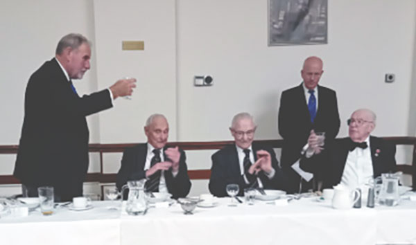 Frank Umbers (left) toasts Gordon and Eddie and Kenneth Jones.