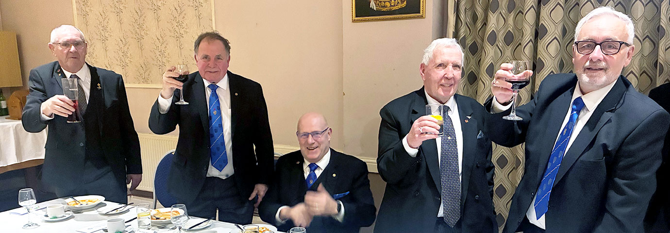 Pictured from left to right standing, are grand officers: Arend Van Duyvenbode, Graham Chambers and Roy Ashley taking wine with Nigel Ainsworth.