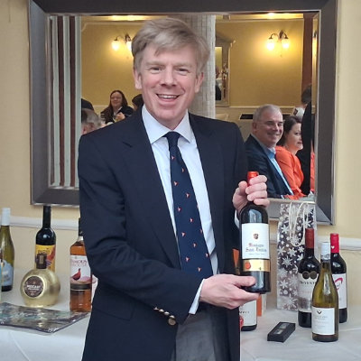 Julian Hale, winner of the lucky envelope draw picking up his prize.