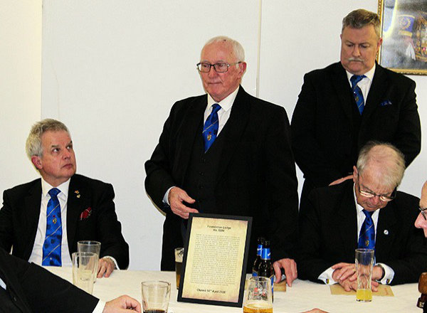Philip Rampling (standing centre) makes the final toast to Foundation Lodge No 5394 members.