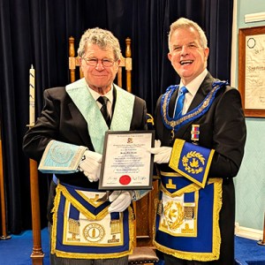 John (left) receiving his 50th anniversary certificate from Stuart