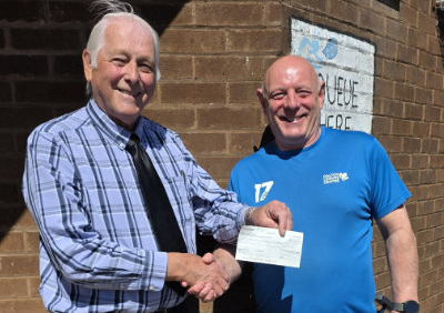 Lodge charity steward David Baker (left) presents the cheque to Bill Maddrick of Dalton Leisure Centre.
