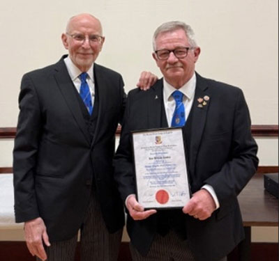 John James (left) and Roy with his golden jubilee certificate.