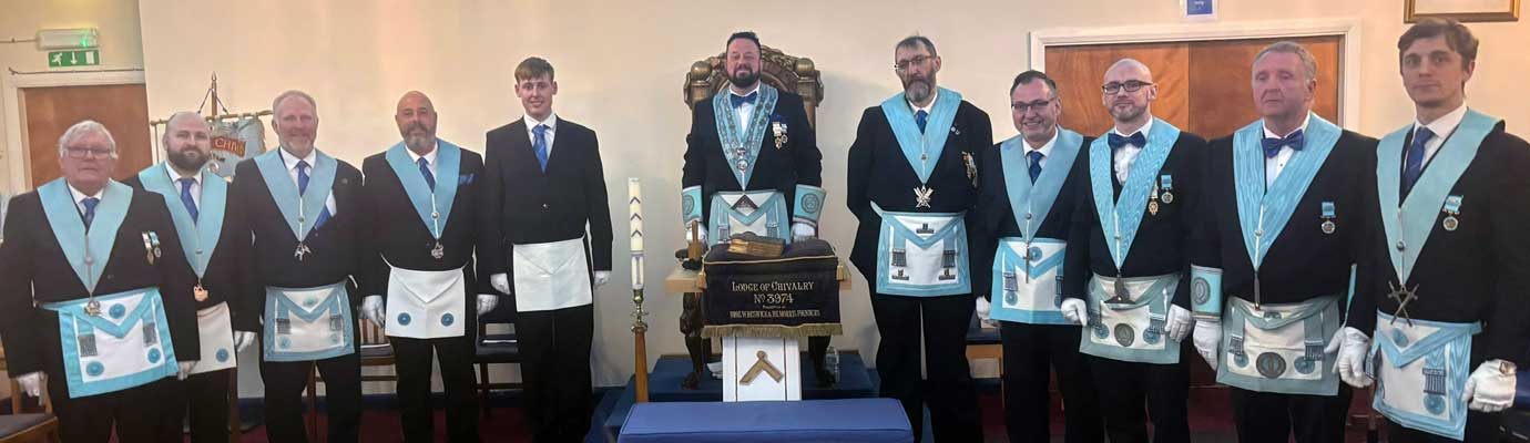 Wayne (centre) with the light blue members of the lodge who were in attendance.