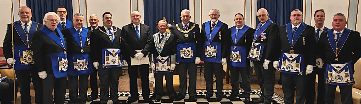 Peter Ivory (centre left) supported by Mark Matthews (centre) with grand and Provincial grand officers. Peter Ivory (centre left) supported by Mark Matthews (centre) with grand and Provincial grand officers.