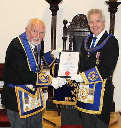 Stuart Boyd presents John Vant with his 50 year certificate.