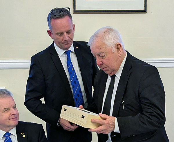 Bob (right) being presented with his gift.