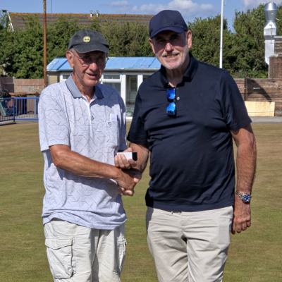 Frank Umbers (right) presents John Cooper with the McGibbon Trophy