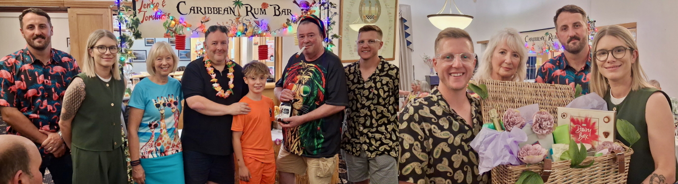 Pictured left: John Nicholls (second from right) presents bottles of refreshment to the limbo dancers. Pictured right: Emily Park (far right) with her pamper-hamper prize. Pictured left: John Nicholls (second from right) presents bottles of refreshment to the limbo dancers. Pictured right: Emily Park (far right) with her pamper-hamper prize.