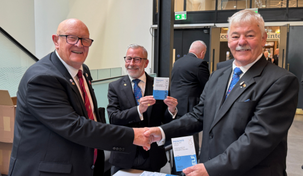 Peter Mann (left) distributing prostate health check kits. Peter Mann (left) distributing prostate health check kits.