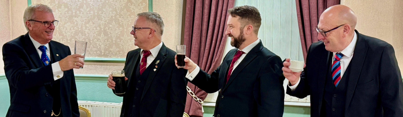 The three Principals toast John Selley (left) at the festive board. The three Principals toast John Selley (left) at the festive board.